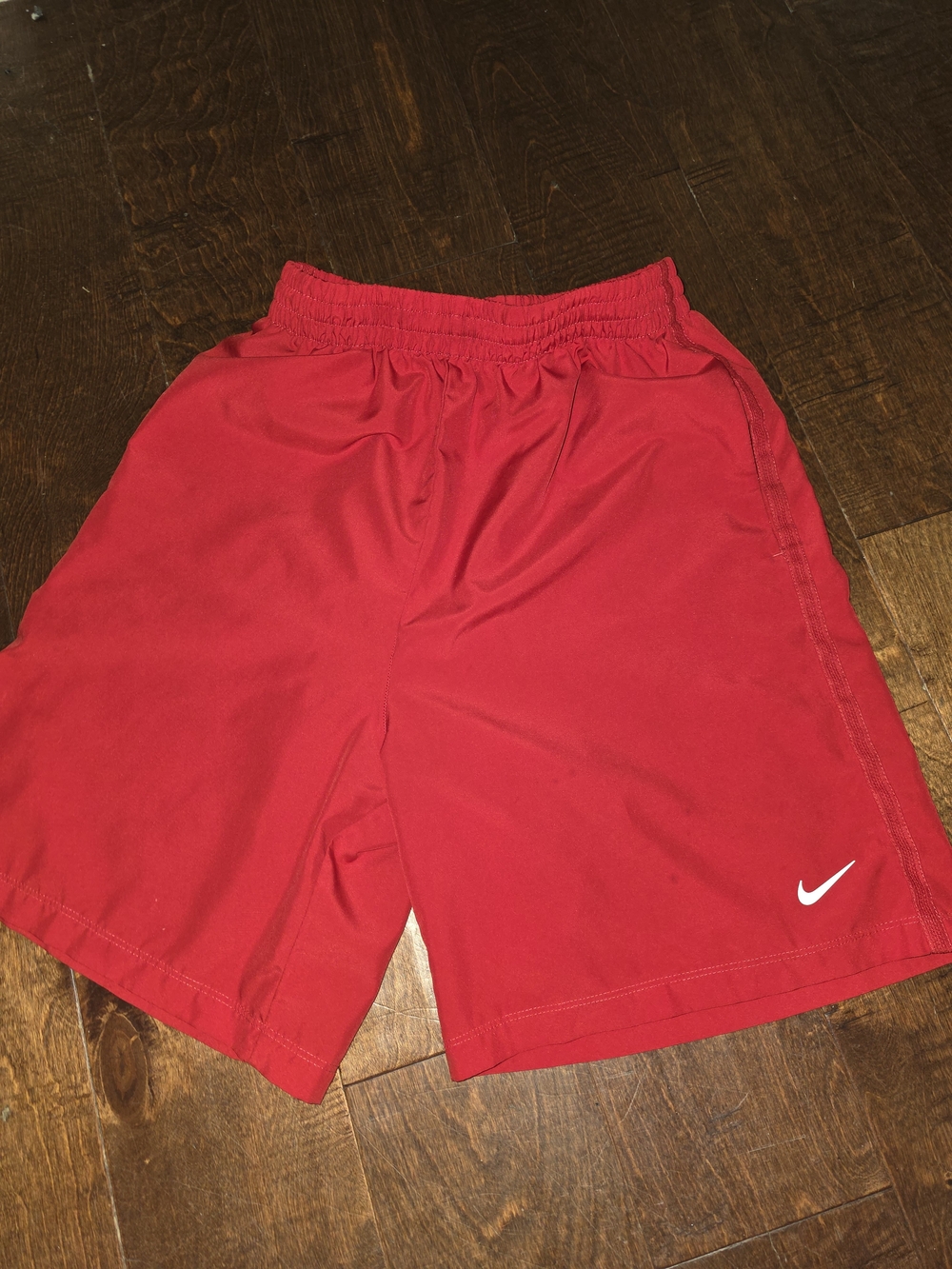 Nike Red Athletic Shorts with White Swoosh